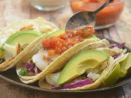 Prepare the fish tacos by filling each tortilla with a spoonful of the coleslaw, grilled fish, avocado slices, and arizona gunslinger smokin' hot mango habanero salsa. Lime Grilled Fish Tacos With Mango Habanero Salsa Az Gunslinger