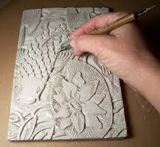 With slabs of clay we created these elegant handbags copying them from paper bags that you find in the shops. Slab Construction Sarah Western