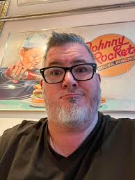 Does the Unlimited Dining pass include Johnny Rockets and require a  reservation?