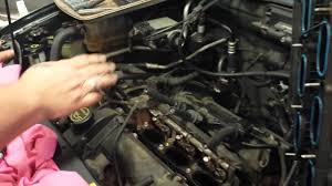 Follow the plug wires back to the coil. 2004 Ford Escape Coil Pack Test Testing The Rear Ones With Intake Removed Youtube