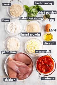 In the first bowl, combine flour, salt and pepper, in the second bowl, beat together 2 eggs and in the third bowl, stir together parmesan and bread crumbs Easy Chicken Parmesan Savory Nothings