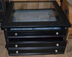 A lower open shelf is included in the lift top coffee table for additional display space and can even hold small organizing bins for hideaway storing options. Lot Nat Geo Home By Lane Furniture Two Drawer Glass Top Display Coffee Table