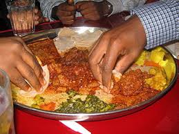 Ethiopian food is served on communal straw a large part of embracing ethiopian food is immersing yourself in the traditional way of eating together. File Ethiopian Food Jpg Wikimedia Commons