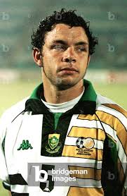 Image of South African soccer team star Mark Fish listens to the