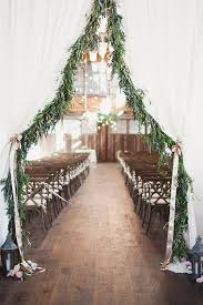 Christmas wedding ideas found in pictures can inspire and help you plan every aspect of your holiday wedding. Seattle Wedding At Sodo Park In Washington State Photos Winter Wedding Trends Garland Wedding Decor Garland Wedding