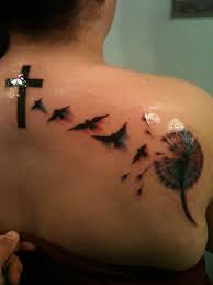 Birds In Flight Tattoo My New Tattoo Its Watercolor Just Got Done Today Birds Flying Out Of Dandelion Up To Heaven Cross Birds Represent Tattoos Trendy Tattoos Watercolor Tattoo