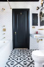 Balance black and white bathroom patterns with areas in plain black or white. 15 Bathrooms With Amazing Tile Flooring