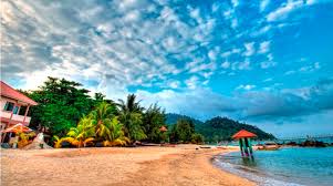 The beach is filled with black pebbles, providing the scenery for a memorable photo opportunity when the evening sky is a lovely hue of purple. Pahang Tourist Attractions Activities And Hotels Guide Holidaygogogo