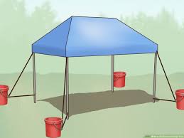 Second corner to the center. 3 Ways To Tie Down A Canopy Tent Wikihow