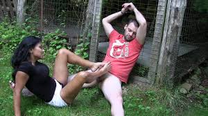 Sexy Jasmine Shy gives a handcuffed stranger an excellent footjob in the  nature