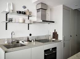 Tour A Small City Apartment Bridging The Divide Between Stylish Flair And Industrial Edge Beige Cabinets Interior Design Kitchen Amazing Bathrooms