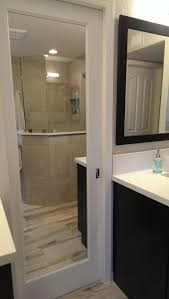 If you have multiple linens, then consider mounting multiple towel bars. Modern Bathroom Closet Doors Novocom Top