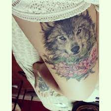 Wolf And Roses Tattoo On Thigh Wolf Tattoos Animal Tattoos Cool Tattoos
