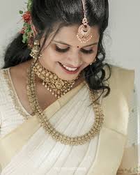 Timeless Bond Amidst the sacred walls of Guruvayur, where tradition meets  timeless love, Abhigami and Amalraj begin their journey together. Wrapped  in elegance of tradition, they vow to cherish each moment with