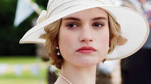 In earlier seasons, she is a fun loving, childish person, till she marries atticus. Hd Wallpaper Downton Abbey Lily James Lady Rose Macclare Wallpaper Flare