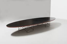 Originally designed in the 1950's, this charles and ray eames designed 'elliptical' or etr 'surfboard' coffee table, designed by charles eames for vitra, with white laminate top, on chrome. Etr Surfboard Coffee Table Charles Ray Eames Archive Modest Furniture