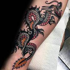 Inked around your hand is a black and grey dragon. 50 Traditional Dragon Tattoo Designs For Men Retro Ideas