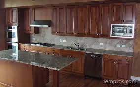 kitchen with maple cabinets, granite