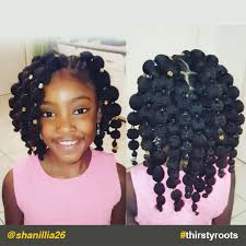 This crazy back and forth style is a very simple way to do something a little bit different. Hair Puff Balls Hairstyle For Little Black Girls