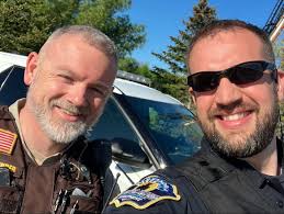 Officer Brandon Plumski and Douglas County Deputy Dustin Alexander were out  at Woodland Elementary School for Big Truck Day, showing the kids the ins  and outs of a squad car!