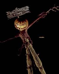 Cartoon illustration of a scarecrow with a pumpkin for a head holding an ear of corn. Pumpkin King The Nightmare Before Christmas Wiki Fandom