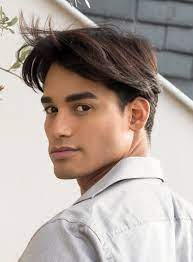 When styling a curtain haircut, apply a wax, cream, or mousse through your hair and spread evenly. The Curtain Haircut Fun Blast From The Past Or Infamous Blunder Curtain Haircut Bleached Hair Men Long Hair Styles Men