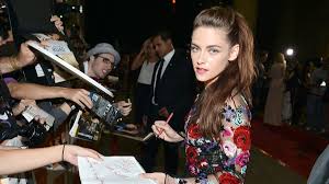 The costars posed for photos on their way into the screening. An Unbowed Kristen Stewart Returns For On The Road Screening