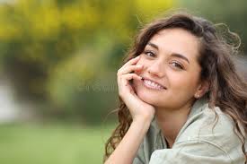 Portrait of a Beautiful Woman Smiling at You Stock Photo