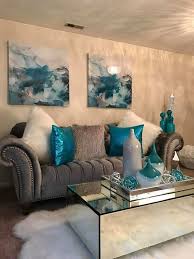 The Bright Blue Pillows Create Contrast In This Living Room Teal Living Rooms Living Room Turquoise Living Room Decor Cozy