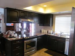 Black kitchen cabinets can set a fantastic groundwork to give your kitchen a sophisticated look and make it stand out of the rest. Black Kitchen Cabinets In Small Kitchen Novocom Top