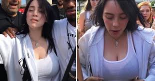 Billie eilish has responded to the cruel comments made about her body after photos of her running around in a tank top went viral. Billie Eilish Tank Top Photo Goes Viral As Viewers Sexualize Famed Star