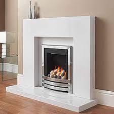 The stone of choice with white marble. Modern Fireplace Surround With Porcelain White Marble Andrea S Innovative Interiors Andrea S Blog Warm Up B Marble Fireplaces White Fireplace Fireplace
