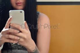 The brunette girl takes selfie on a modern touch smartphone - stock photo  964315 | Crushpixel