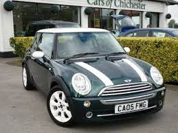 The New Mini Cooper S In British Racing Green With White Roof And Stripes Mini Cars New Mini Cooper Black Mini Cooper