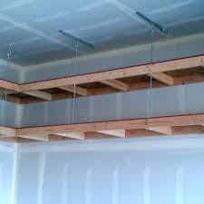 This diy overhead garage storage pulley system is for you. Overhead Garage Shelves Garage Storage Shelves Garage Ceiling Storage Garage Storage