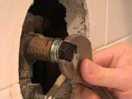 The plastic tool that came with the new cartridge. Moen Shower Faucet Cartridge Removal Tool