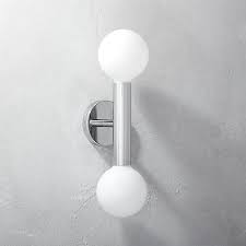 Halogen bath lights, which are brighter, are also worth considering. Shop Double Post Sconce Understated Design By Mermelada Estudio Is Alluring In Its Simplicity Shiny C Modern Bathroom Lighting Modern Wall Sconces Sconces