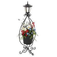 By day, these frosted white planters add a contemporary accent. The Solar Illuminated Planter Hammacher Schlemmer