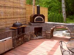 Beautiful Outdoor Kitchen With The Mario Batali Etna Grande Wood Fired Pizza Oven As The M Outdoor Kitchen Countertops Kitchen Remodel Countertops Outdoor Wood