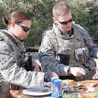 U.S. Marine Corps Master Sgt. Luis Guardado, left,