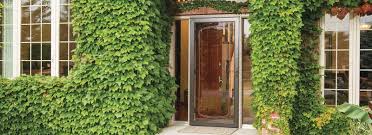 The closer is secured with screws on one end to the screen door. Pella Storm Doors Pella