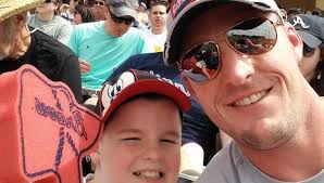 Hero dad's quick reflexes save his son at Braves baseball game