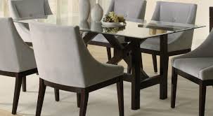 For a sleek, modern appearance, try a glass top dining room set with a clear pane resting on a metal base. Design Ideas Rectangular Brown Glass Tables Glass Dining Table Set Wooden Dining Room Table Square Glass Dining Room Table