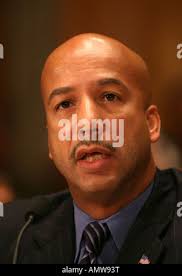 New Orleans Mayor Ray Nagin, left, and Dr. Edward Blakely , executive  director of recovery management, center, talk to artist Andrew Brott at the  first Freret Market, the second target recovery project