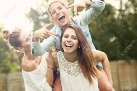 Friends having fun with smartphones. Picture Presenting Happy Group Of Women Having Fun Outdoors Stock Photo Picture And Royalty Free Image Image 62498087