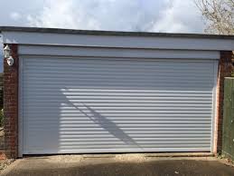 We offer quality garage door installation, maintenance and repair services on an enormous range of steel, grp and timber doors throughout buckinghamshire, bedfordshire and hertfordshire, call 01525 220 212. White Double Seceuroglide Roller Garage Door Shutter Spec Security