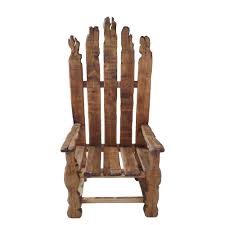 Crafted of solid wood in a warm cherry stain, this chair features a mid backrest, fixed arms, and four carved legs on hooded caster wheels. Hand Carved Wooden Throne Chair
