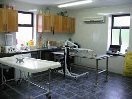 Embalming Room With Embalming Table On Left Dressing Table To The Right With A Body Lift To Place Body Into Casket Funeral Home Embalmer Mortuary