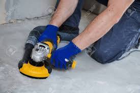 The process of scarifing the floor is called concrete floor prep or surface preparation. Concrete Floor Surface Grinding By Angle Grinder Machine Stock Photo Picture And Royalty Free Image Image 118735530