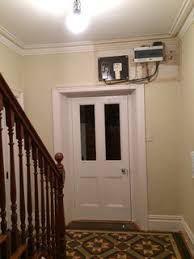 To hide the ugly electric box, you may build a wooden barrier around it. How Best To Hide These Electrics Above Our Victorian Front Door Houzz Uk